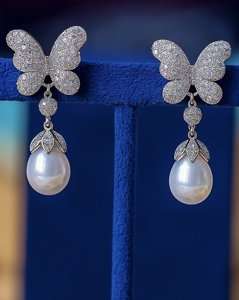 White pearl butterfly earings